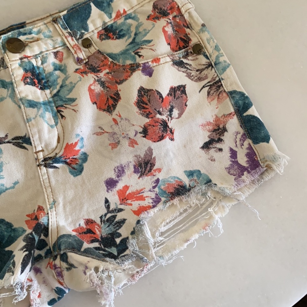 Free People Floral High-Waist Jean Shorts in Cream with Teal, Red, Purple Print